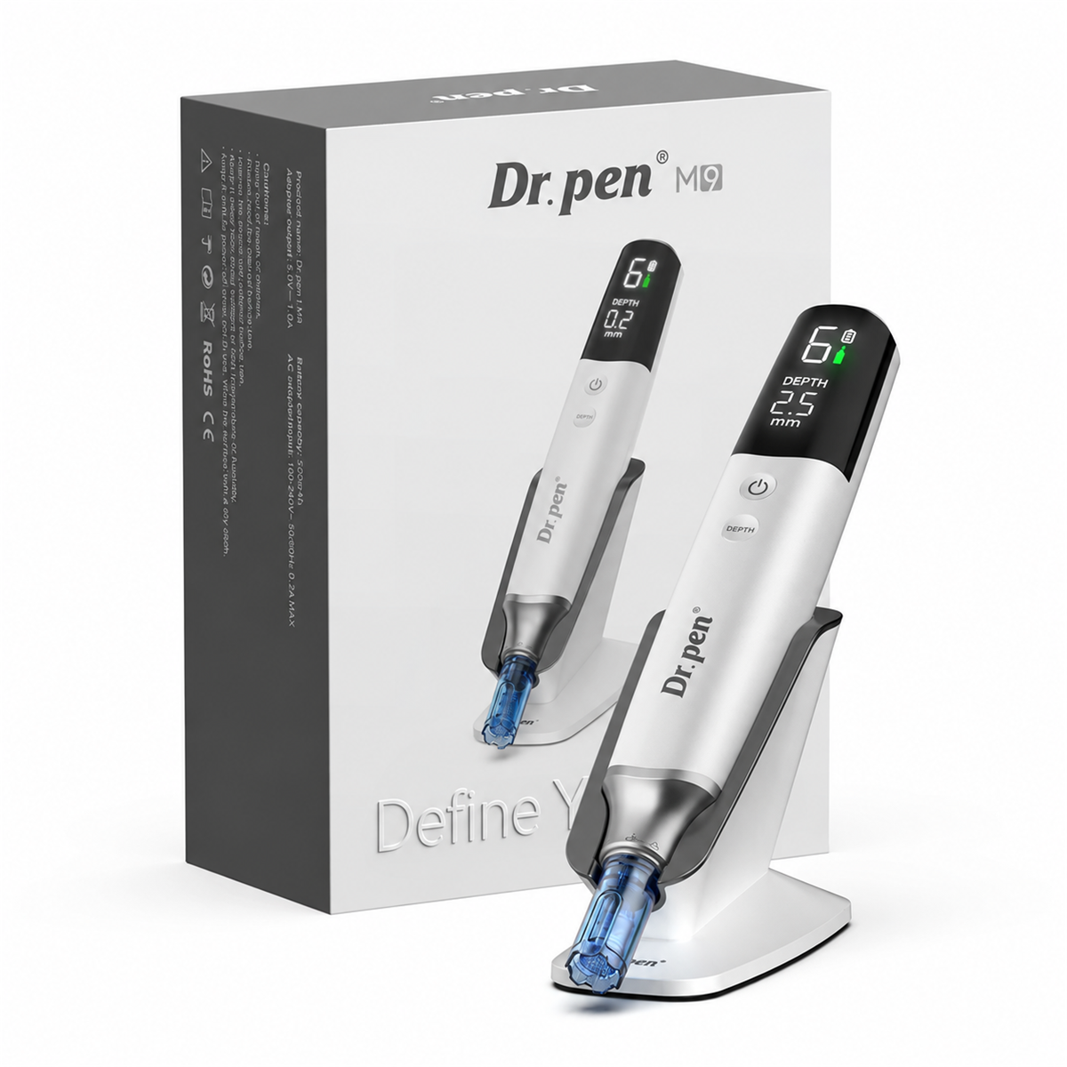 Dr. Pen M9 putih di atas penyangga di sebelah kotak produk asal